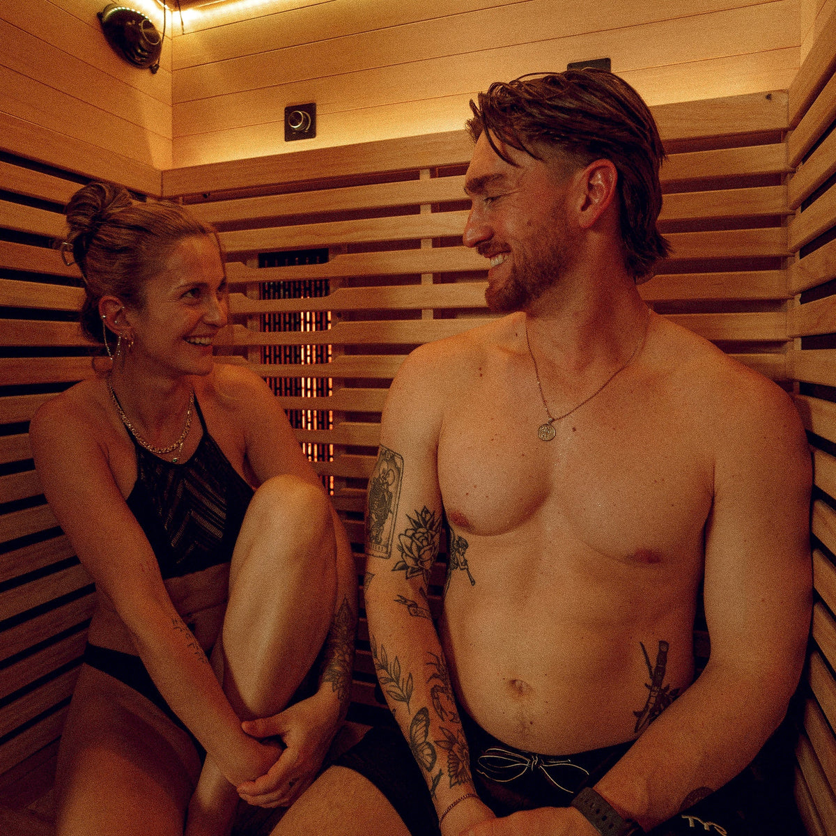 Two people relaxing in a Nordik infrared sauna